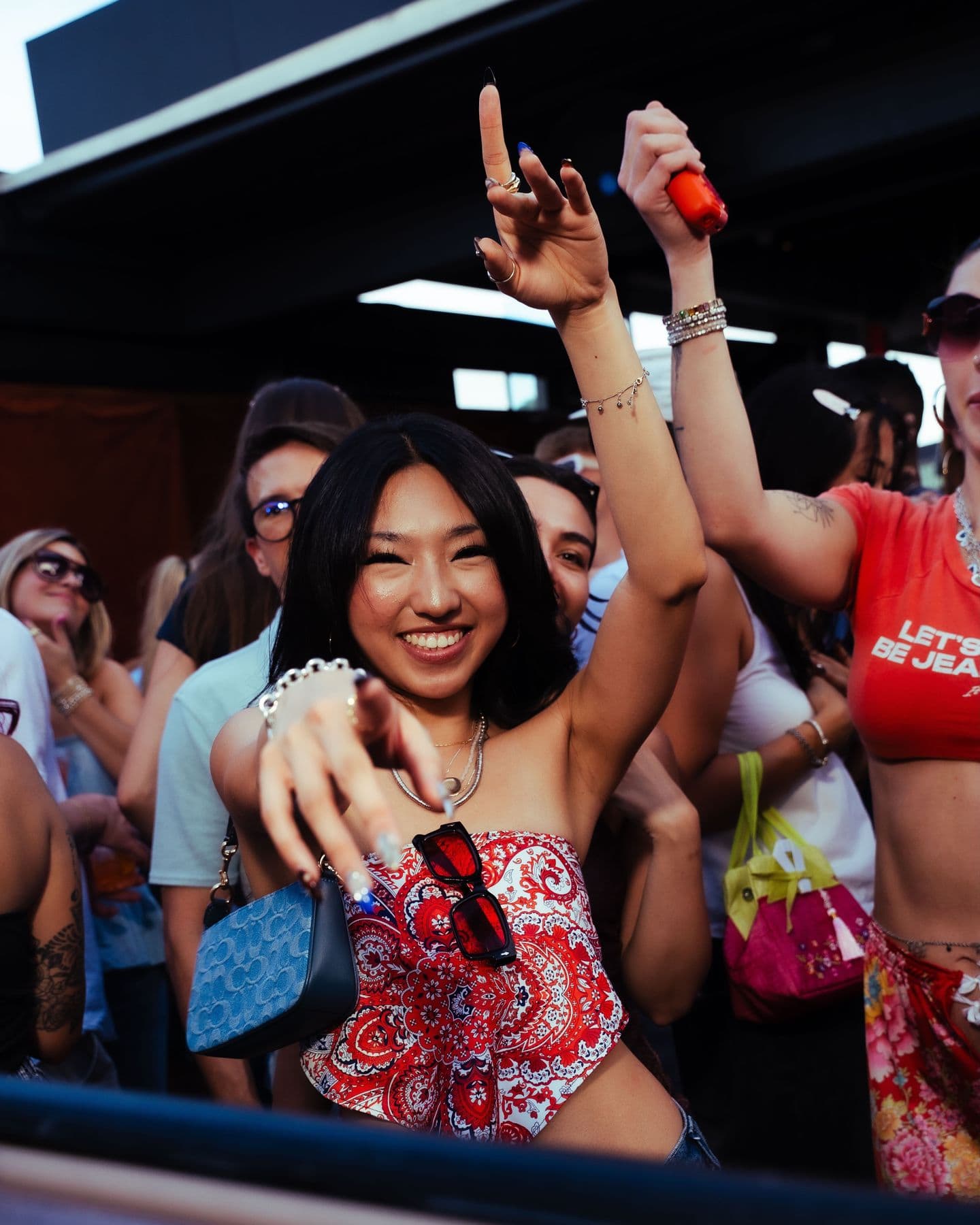 A Groover smiling and pointing at the camera on the dance floor